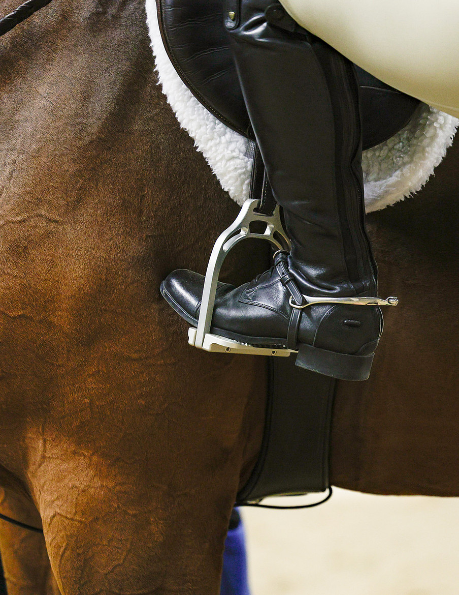 A rider's polished boot and iron in classic equitation position, Foothills Autumn Hunter Derby